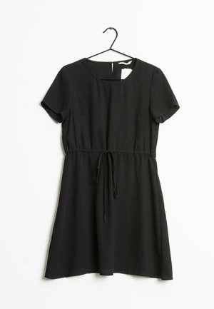 Black short-sleeve dress with round neckline and waist tie, hanging on a black hanger against a white background.