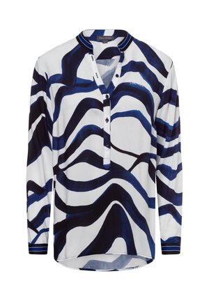 Blusa a maniche lunghe bianca con strisce ondulate blu navy, patta con bottoni e colletto a strisce in contrasto. Tessuto morbido, vestibilità rilassata.