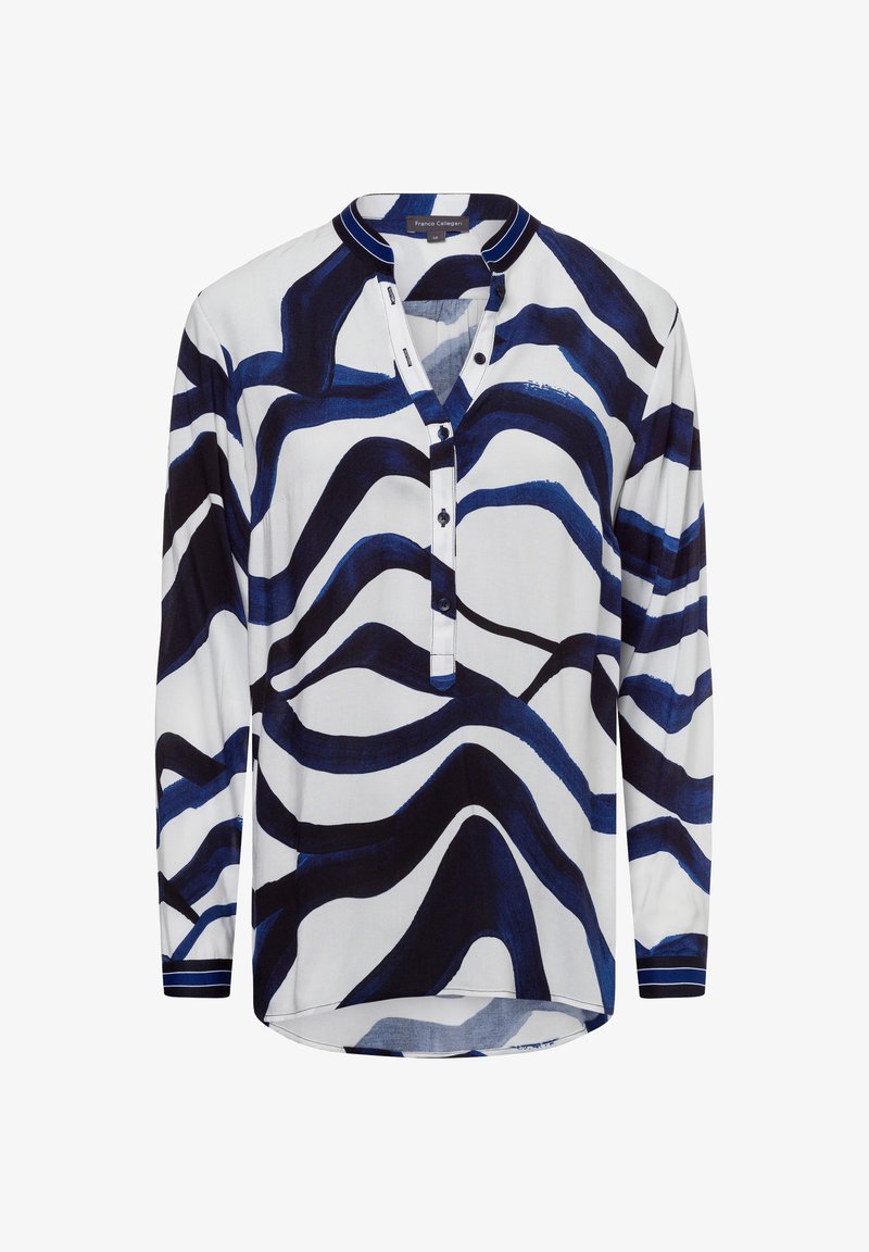 Blusa a maniche lunghe bianca con strisce ondulate blu navy, patta con bottoni e colletto a strisce in contrasto. Tessuto morbido, vestibilità rilassata.