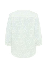 Weiße Bluse mit langen Ärmeln, verziert mit einem floralen Spitzenmuster und leicht gerafften Manschetten, Rückansicht.