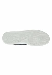Shoe sole in white rubber with a textured grip pattern, featuring a round emblem and a logo on the side. Flat design, lightweight appearance.