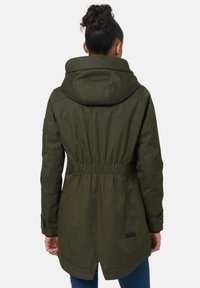 Olive green parka jacket with a cinched waist, large hood, and buttoned cuffs. Features a logo patch and a longer back hem.