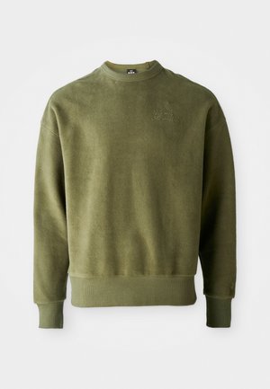 Olive green sweatshirt with a textured finish, long sleeves, ribbed cuffs and hem, and subtle embroidered detail on the chest.
