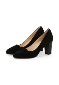 Escarpins en daim noir à talons hauts avec un bout arrondi et un nœud décoratif sur le cou-de-pied. Talon bloc avec une doublure intérieure lisse.