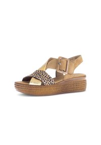 Tan sandals with leopard print and metallic gold accents. Features a wedge sole and an adjustable buckle strap for secure fitting.