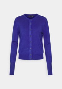 Fioletowy kardigan wykonany z miękkiego, lekkiego materiału. Posiada okrągły dekolt, długie rękawy, zapinany na guziki przód oraz ściągacze na mankietach.