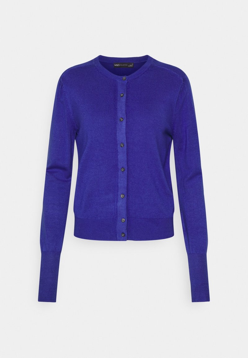 Fioletowy kardigan wykonany z miękkiego, lekkiego materiału. Posiada okrągły dekolt, długie rękawy, zapinany na guziki przód oraz ściągacze na mankietach.