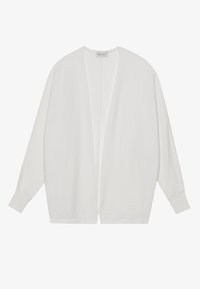 Vit kofta tillverkad av mjukt tyg med en lös, öppen framdesign, långa ärmar och ribbade ärmslut. Har en minimalistisk estetik.