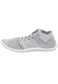Gray knitted athletic shoe with a low top design, white sole, and textured accents. Features elastic laces and breathable mesh material.