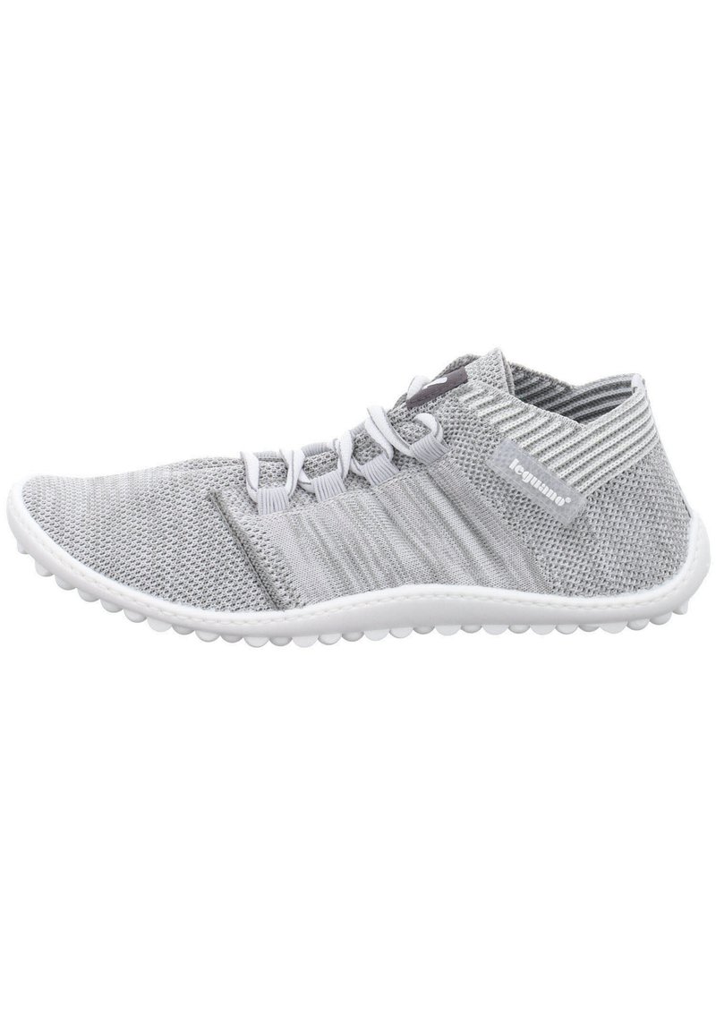 Gray knitted athletic shoe with a low top design, white sole, and textured accents. Features elastic laces and breathable mesh material.