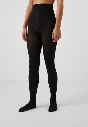 Collant neri a coste con un alto cinturino in vita, caratterizzati da una texture liscia e un design aderente, che coprono dalla vita ai piedi.
