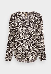 Blusa de mangas longas com um padrão floral preto e branco. Feita de tecido leve, com um decote em V e uma bainha ligeiramente curvada.