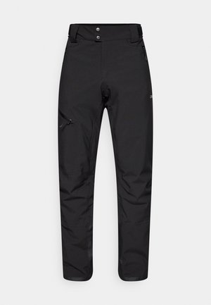 Mustad mustos värviga välispüksid, mis on valmistatud vastupidavast ja kergest materjalist. Omab lukuga taskut vasakul reiel ja kaht nupukinnituskoht.