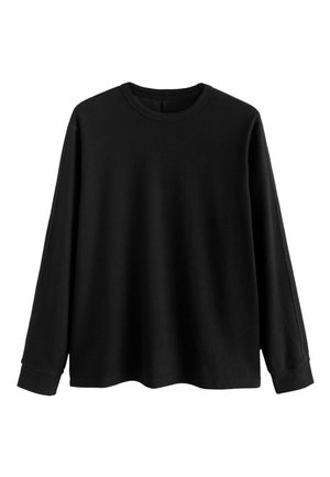 Schwarzer Pullover mit langen Ärmeln aus weichem Stoff, runder Ausschnitt, lockere Passform und gerippte Bündchen. Minimalistisches Design, keine zusätzlichen Muster.