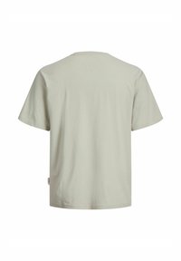 Μπεζ βαμβακερό T-shirt με κοντά μανίκια, εμφάνισή του από πίσω με στρογγυλή λαιμόκοψη και ίσια βάση.