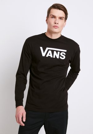 Camiseta de manga larga negra hecha de algodón con un logo blanco de "VANS" impreso de forma prominente en la parte delantera. Cuello redondo con puños acanalados.