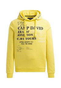 Gelbe Baumwoll-Hoodie mit schwarzem Grafiktext und gedruckten Details. Er hat eine Kapuze mit Kordelzug und gerippte Bündchen sowie einen gerippten Saum.