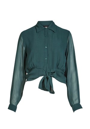 Tirkīzzila blūze ar garām caurspīdīgām piedurknēm, pogas priekšpusē, apkakli un mezgla detaļu pie vidukļa. Mīksts auduma tekstūra.