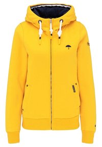 Felpa con cappuccio gialla con zip, realizzata in tessuto morbido, presenta un cappuccio con coulisse, due tasche laterali e un logo a forma di ombrello sul petto.