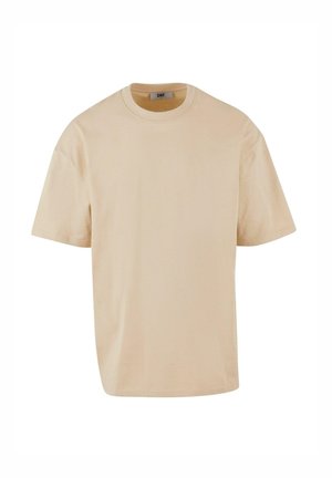 Beige Baumwoll-T-Shirt mit kurzen Ärmeln, Rundhalsausschnitt, lässiger Passform und minimalistischem Design. Keine sichtbaren Muster oder Akzente.