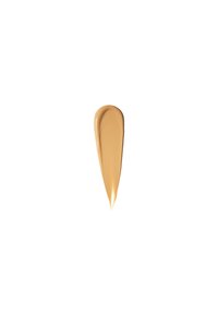 Campionatura di trucco beige crema con una consistenza liscia e lucida, di forma allungata a goccia, posizionata su uno sfondo bianco.