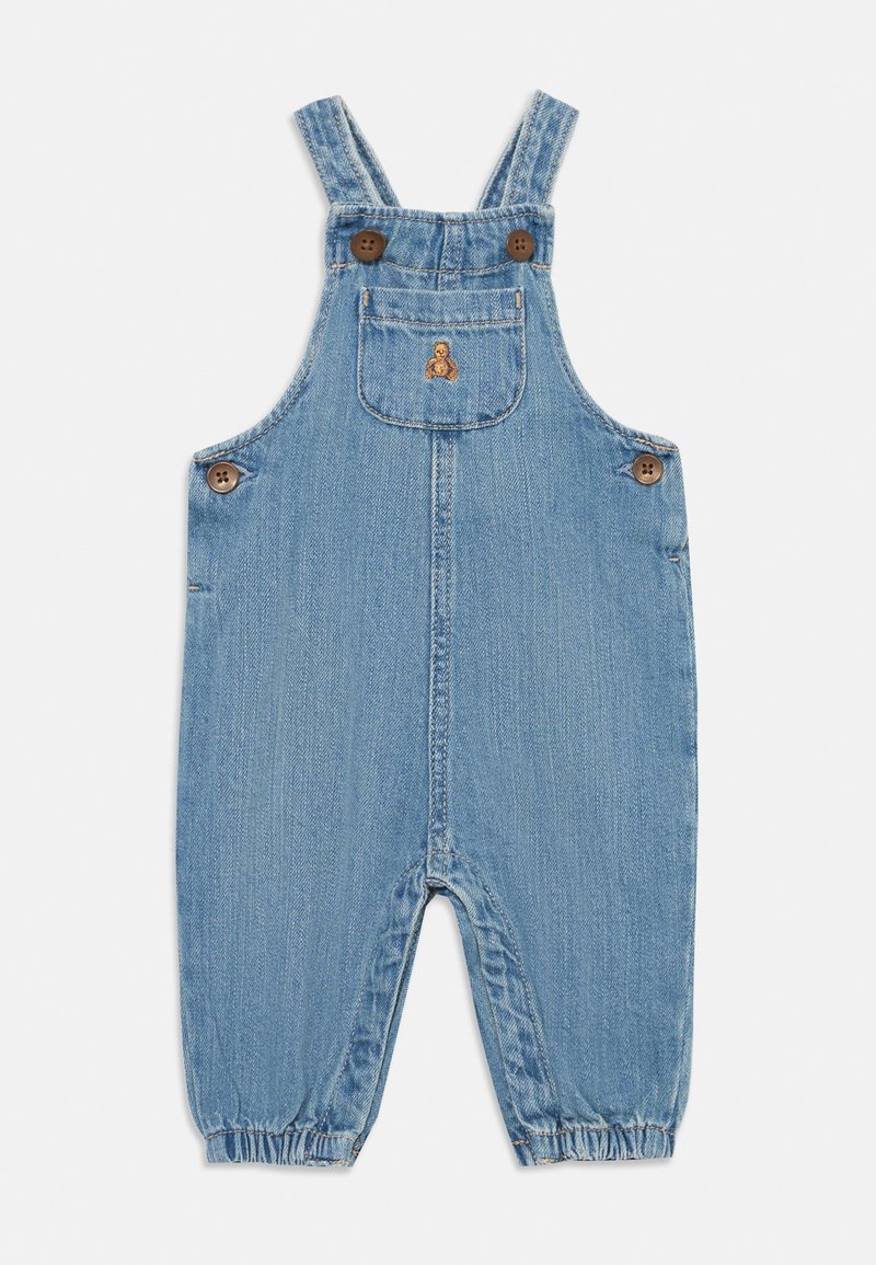 Jeansbyxor i ljusblått med justerbara remmar, platt ficka, två träknappar, elastiska muddar och en broderad björndetalj på bröstet.