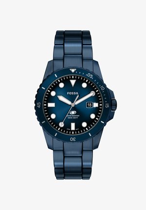 Blue stainless steel Fossil wristwatch with round face, white hour markers, date display, and rotating bezel, water resistant 100m.