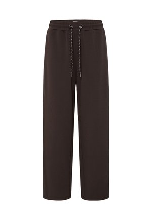 Pantalon de jogging marron foncé à coupe large avec taille élastique et cordon noir et blanc, présenté sur fond blanc.