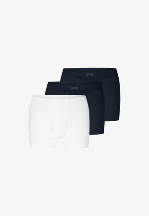 Tre par herre boxershorts med elastiske linninger, to i sort og en i hvid, vist side om side på hvid baggrund.