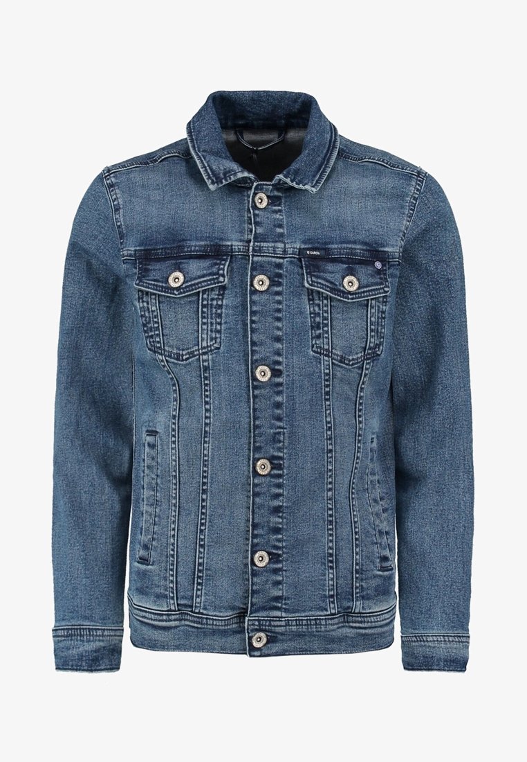 Jeansjacka i mörkblå. Har klassisk krage, knäppning fram, två bröstfickor och sidfickor. Sliten struktur över tyget.