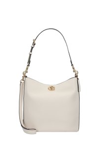 Cream leather handbag with a curved shape, black trim, and a gold turn-lock closure. Features an adjustable strap for versatile carrying.