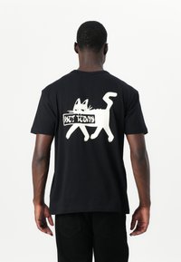 Black cotton t-shirt featuring a white graphic of a walking cat and the text "NOT TODAY" on the back. Short sleeves and relaxed fit.