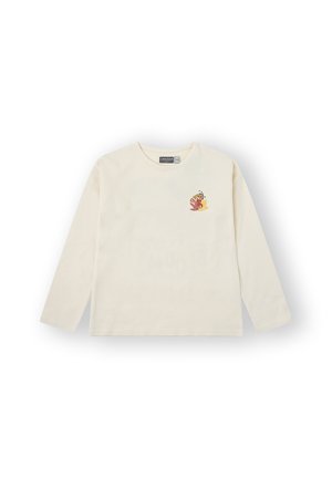 Camiseta de manga larga de color crema hecha de algodón, con un pequeño diseño floral colorido en el lado izquierdo del pecho.