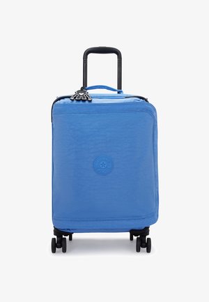 Blue carry-on suitcase with a smooth fabric exterior, black retractable handle, four wheels, and a logo patch on the front.
