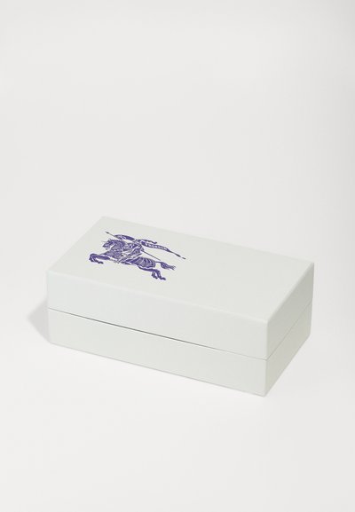 White rectangular box with a glossy finish, featuring a purple embossed illustration of a unicorn. Box has a hinged lid design.