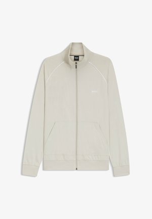 Veste beige clair zippée avec col montant, poches avant, manches longues et logo "BOSS" sur la poitrine gauche.