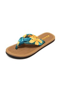 Chancla de dedo con una tira de tela floral trenzada en tonos verde azulado y amarillo. Presenta una plantilla texturizada en marrón y una suela de goma negra.