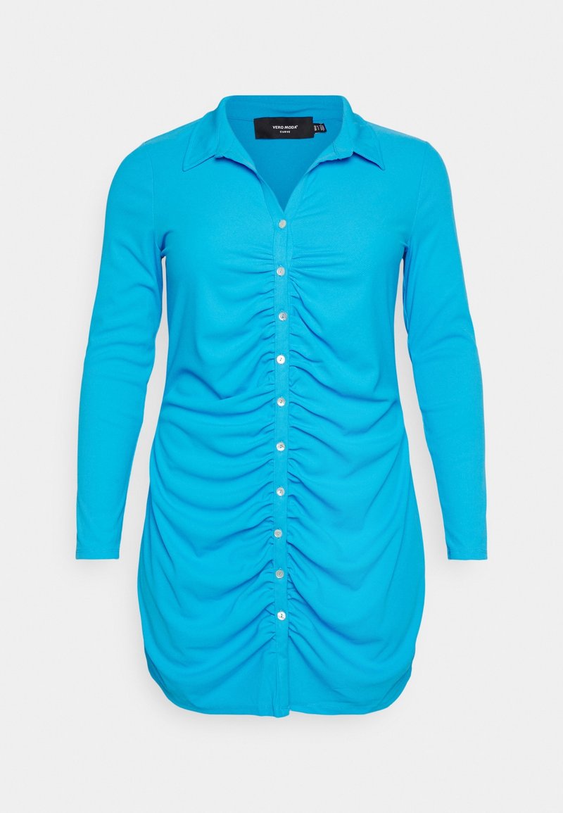 Robe bleu vif à manches longues, boutonnée avec col et drapé froncé au centre devant.
