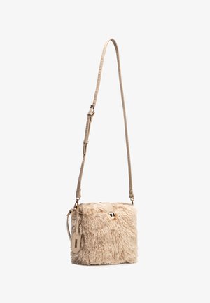 Beige faux fur crossbody bag with adjustable strap, metallic clasp, and small rectangular tag hanging on the side.