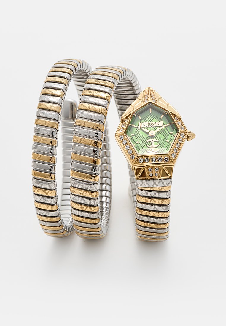 Reloj metálico elástico de oro y plata con esfera hexagonal, dial con patrón verde y piedras de strass. Dos secciones de banda flexibles, eslabones texturizados.