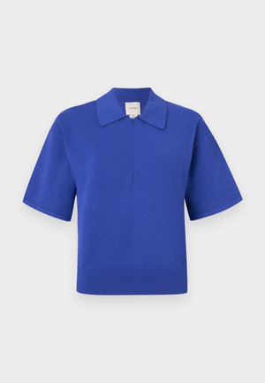 Short-sleeve pullover in cobalt blue knit fabric, featuring a flat collar and a half-zip front. Smooth texture with ribbed bottom hem.