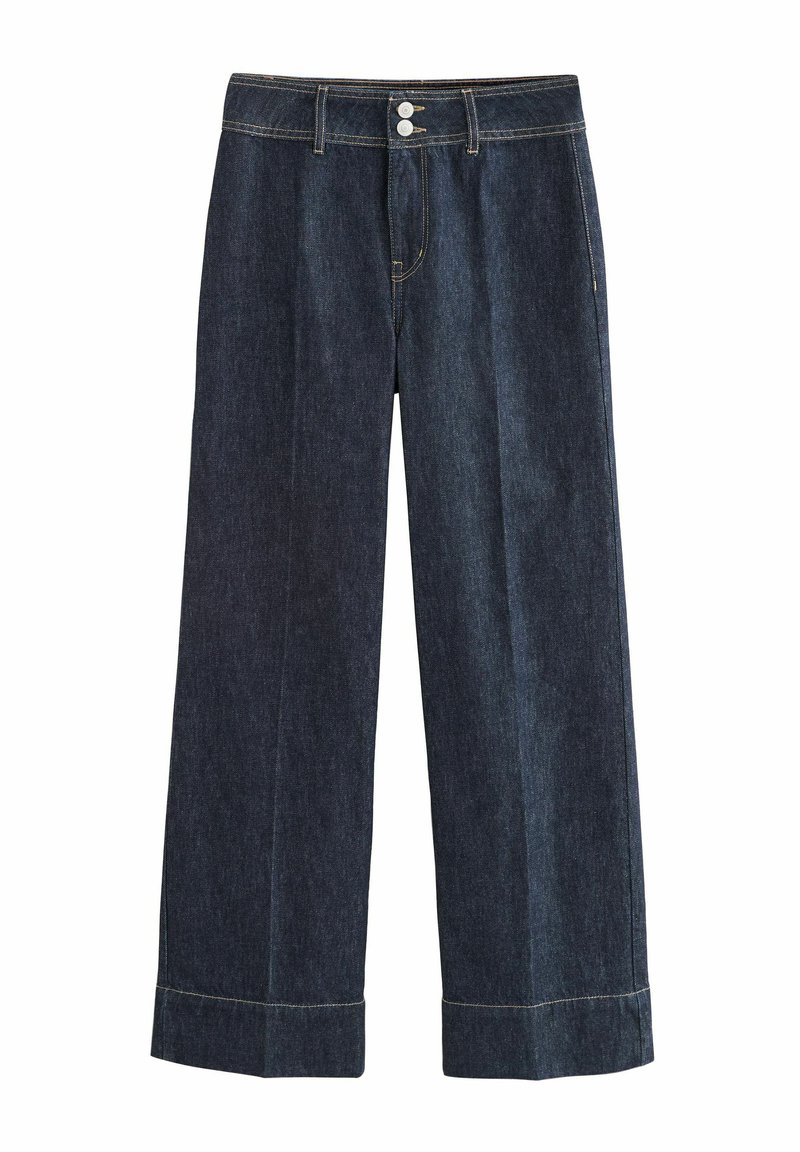 Brede denim broek in donker indigo, met knoopsluiting, dubbele knopen en omgeslagen mouwen. Glad textuur met contrasterende stiksels.