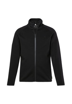 Chaqueta negra con cremallera fabricada en tejido suave, con cuello alto, mangas raglán y un logo minimalista en el pecho. Presenta una cremallera en contraste.