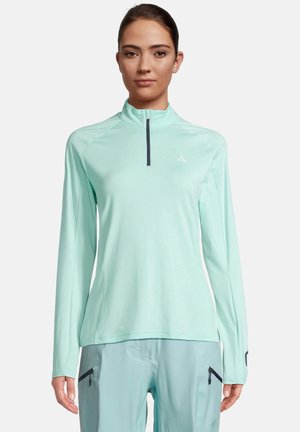 Haut de sport léger, vert menthe, à manches longues avec un col montant, une fermeture éclair quart et un logo de marque subtil sur la poitrine. Texture lisse.