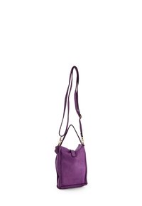 Purple leather crossbody bag with adjustable strap, flap closure, and small handle, brand name "Venezia" embossed on front.