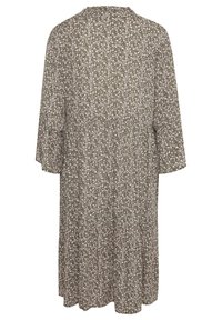 Grünes Kleid mit floralem Muster, langen Ärmeln, knielang, mit rundem Halsausschnitt und einer lockeren, fließenden Form. Strukturierter Stoff mit dezenten Mustern.