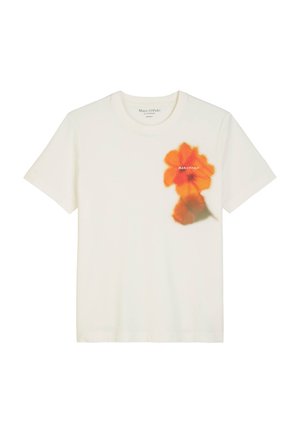 White cotton t-shirt featuring an orange floral print on the left side and subtle brand text below the graphic. Crew neck and short sleeves.