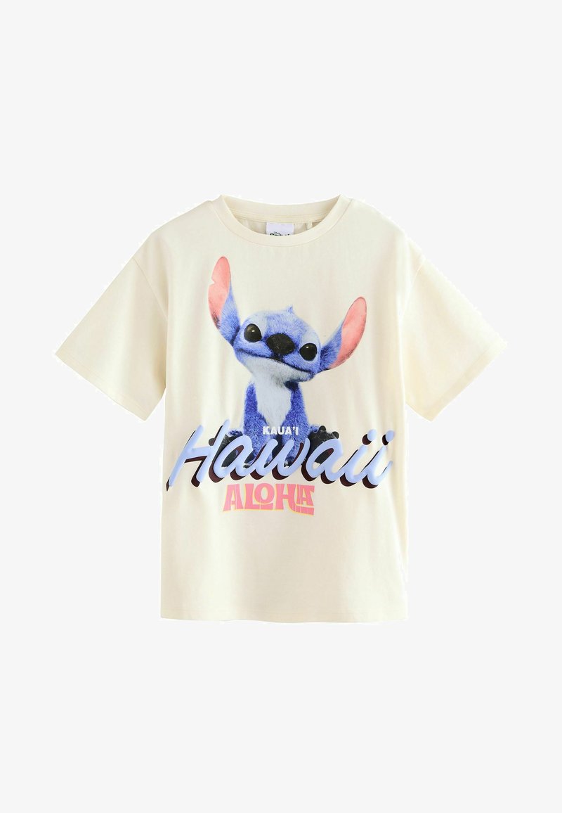 Camiseta de algodón color crema que presenta un personaje de dibujos animados azul con orejas rosas y el texto "Kaua'i Hawaii Aloha" en una impresión colorida. Mangas cortas.