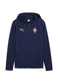 Jūros tamsiai mėlynas zip-up džemperis, pagamintas iš minkštos medžiagos. Yra auksinis Puma logotipas, Portugalijos herbas ir žalios bei raudonos šoninės detalės. Su kapišonu.