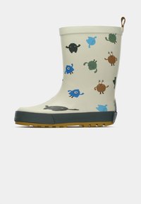 Bottes de pluie pour enfants beige avec semelle en caoutchouc, décorées de monstres de dessin animé colorés en bleu, vert, marron et noir.
